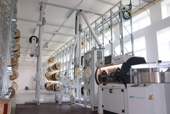 Semi-automatic cable reel rack LA 03 with mobile platform on which Ramatech's unwinder, cable cutting machine and ring coilers are located